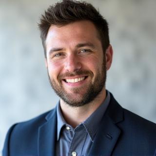 Professional headshot of Marcus Reid.